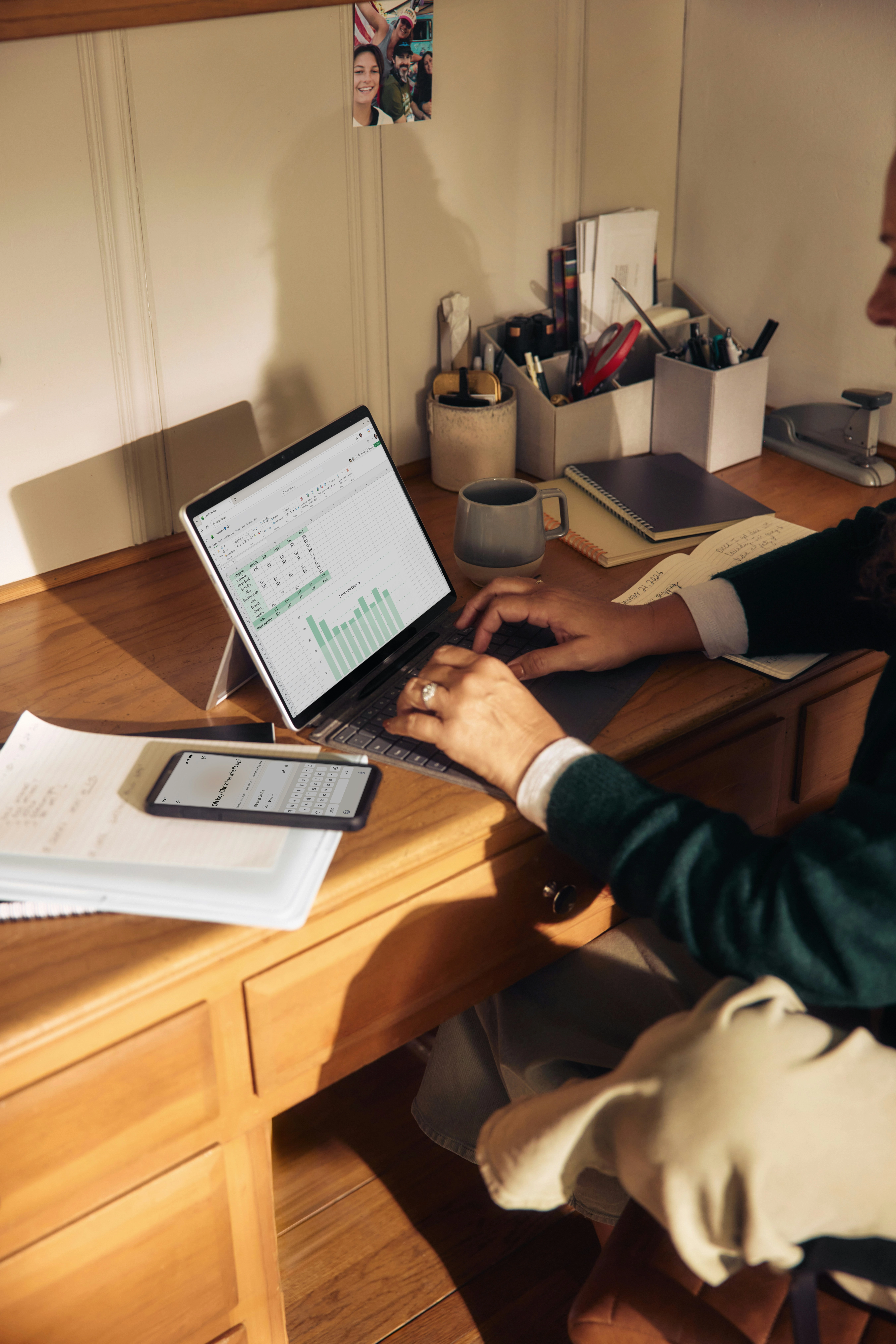 Hand checking off items on a work permit document checklist